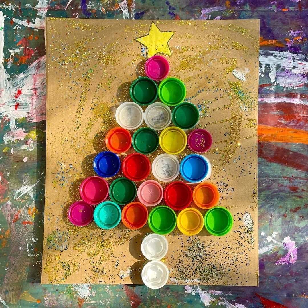 A vibrant Christmas tree crafted from plastic cups, resembling a Bottle Cap Tree.