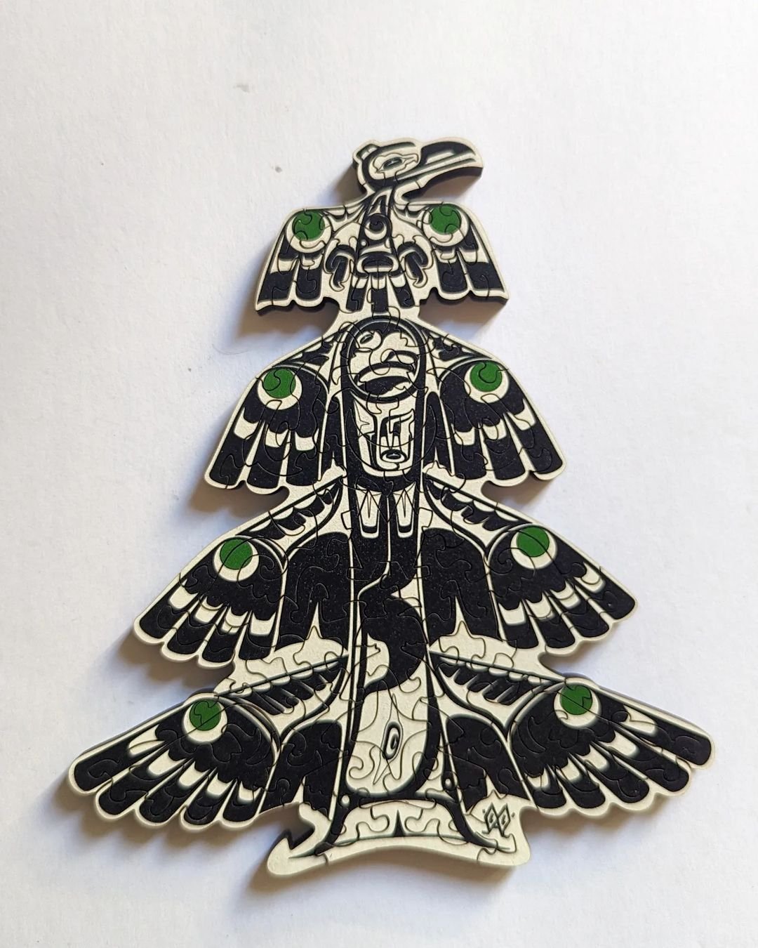 Pin with bird charm, green eyes, part of Puzzle Piece Tree collection.