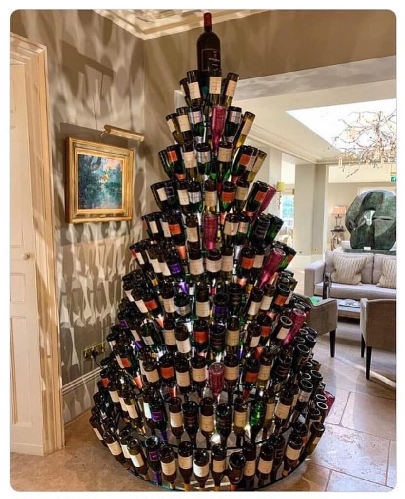 A festive Christmas tree made entirely of wine bottles, creating a unique and eco-friendly decoration.