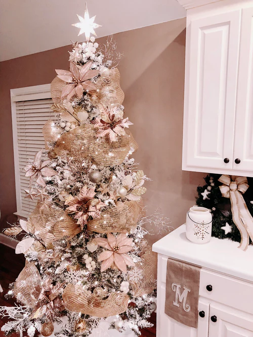 Christmas tree adorned with white and gold ornaments, featuring Deco Mesh Tree.